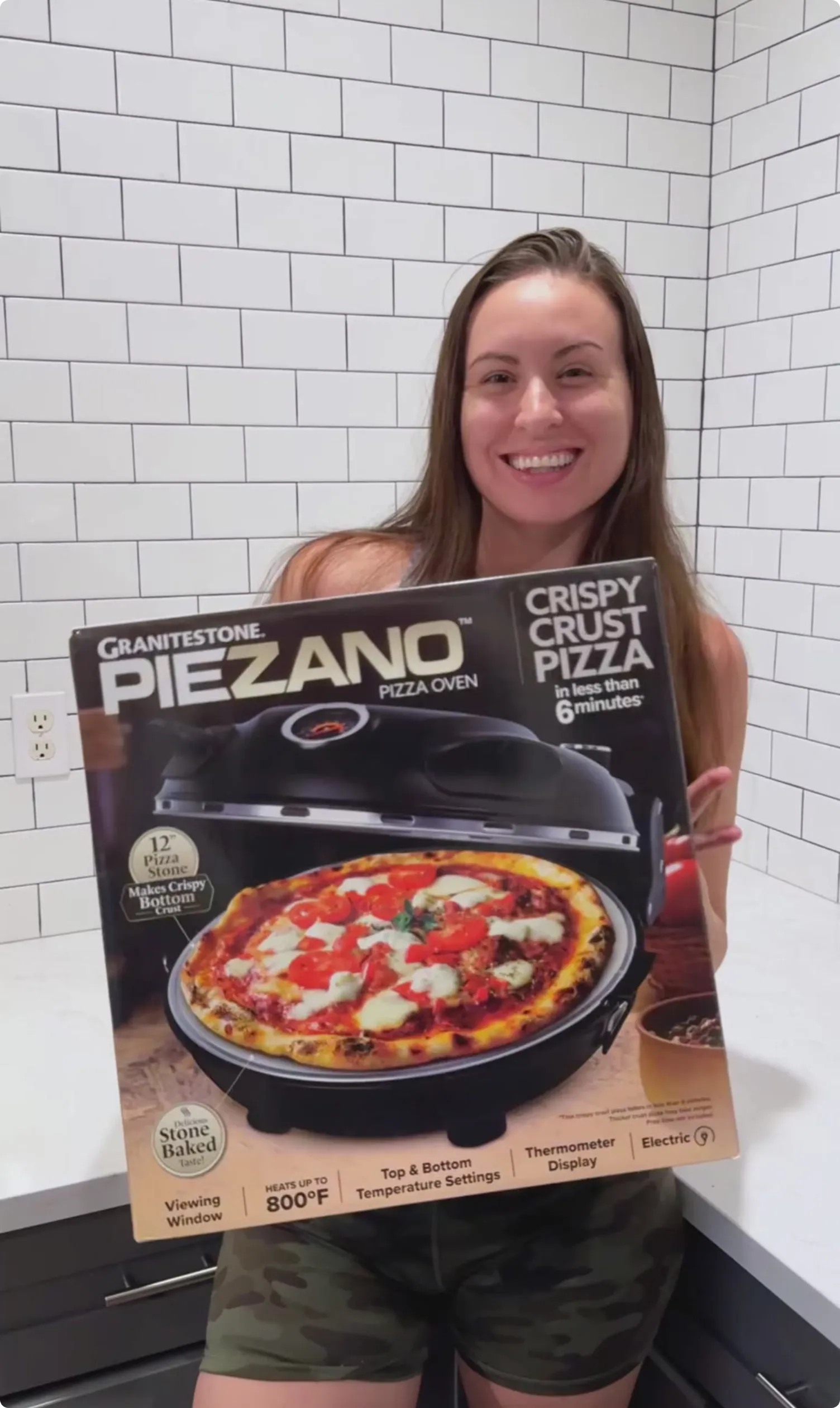 person using Piezano Pizza Oven